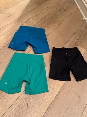 lululemon athletica turquoise, teal & black women’s athletic shorts (3 pack)